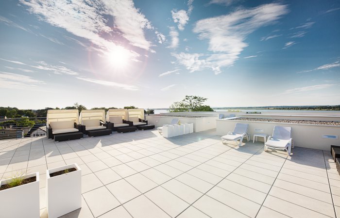 ROOFTOP TERRACE WITH A VIEW OF THE LAKE