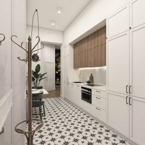 Nowoczesny apartament w Krakowie – elegancki korytarz połączony z funkcjonalnym aneksem kuchennym.