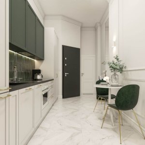 Funkcjonalna przestrzeń kuchenna ze stolikiem i krzesłami – wygodne miejsce do posiłków.