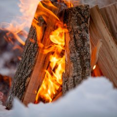 Winter feasts by the campfire with sausage roasting