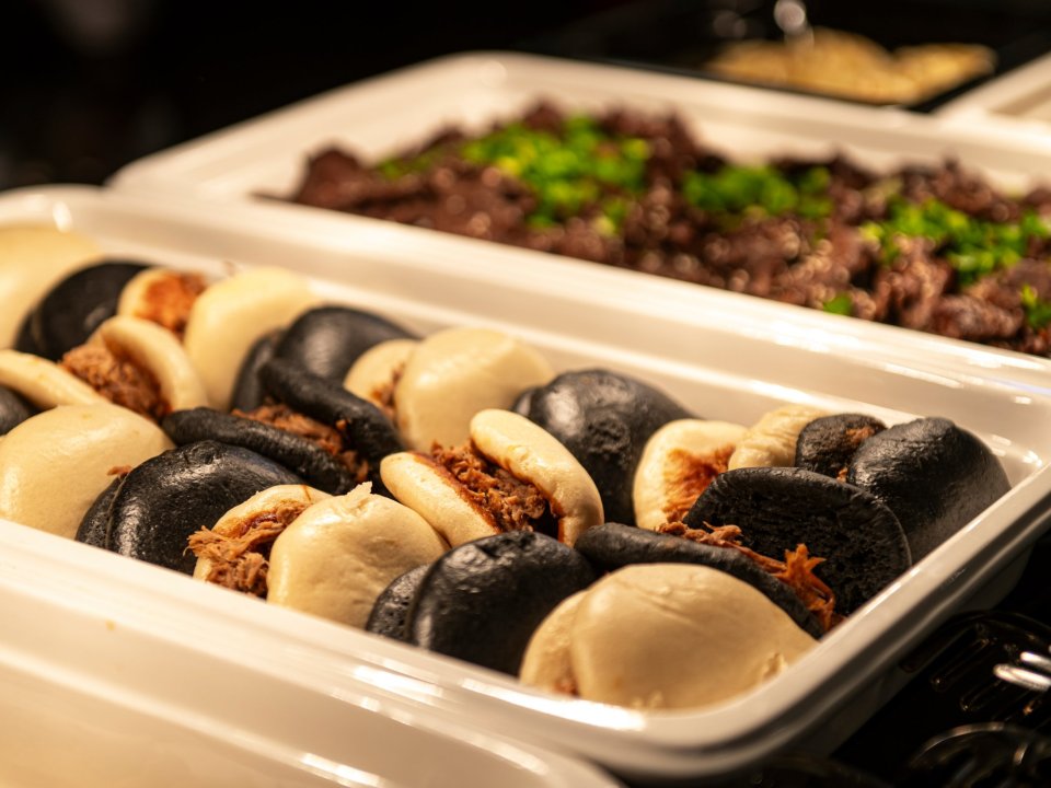 Bao buns and snacks at a food station during an event at o3Hotel
